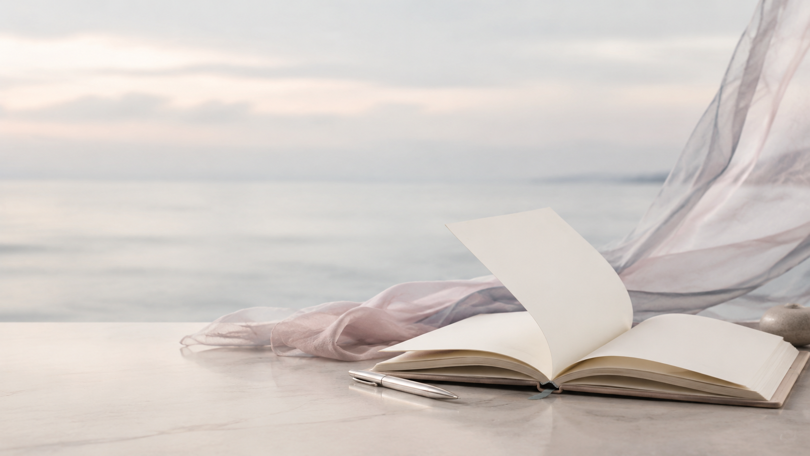 An open notebook beside the sea, a space to consider what comes next